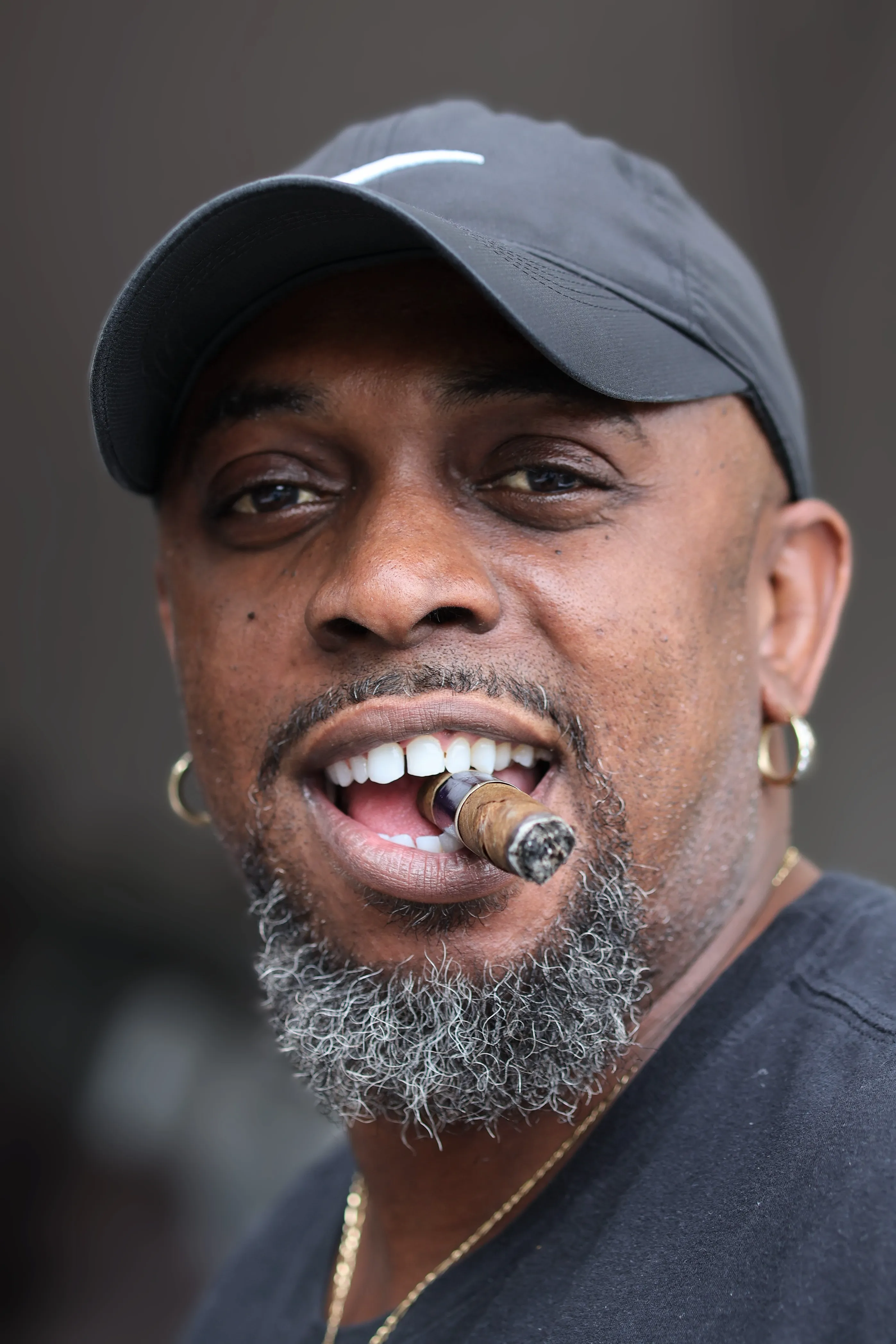 Portrait - man smiling with cigar, lively energy