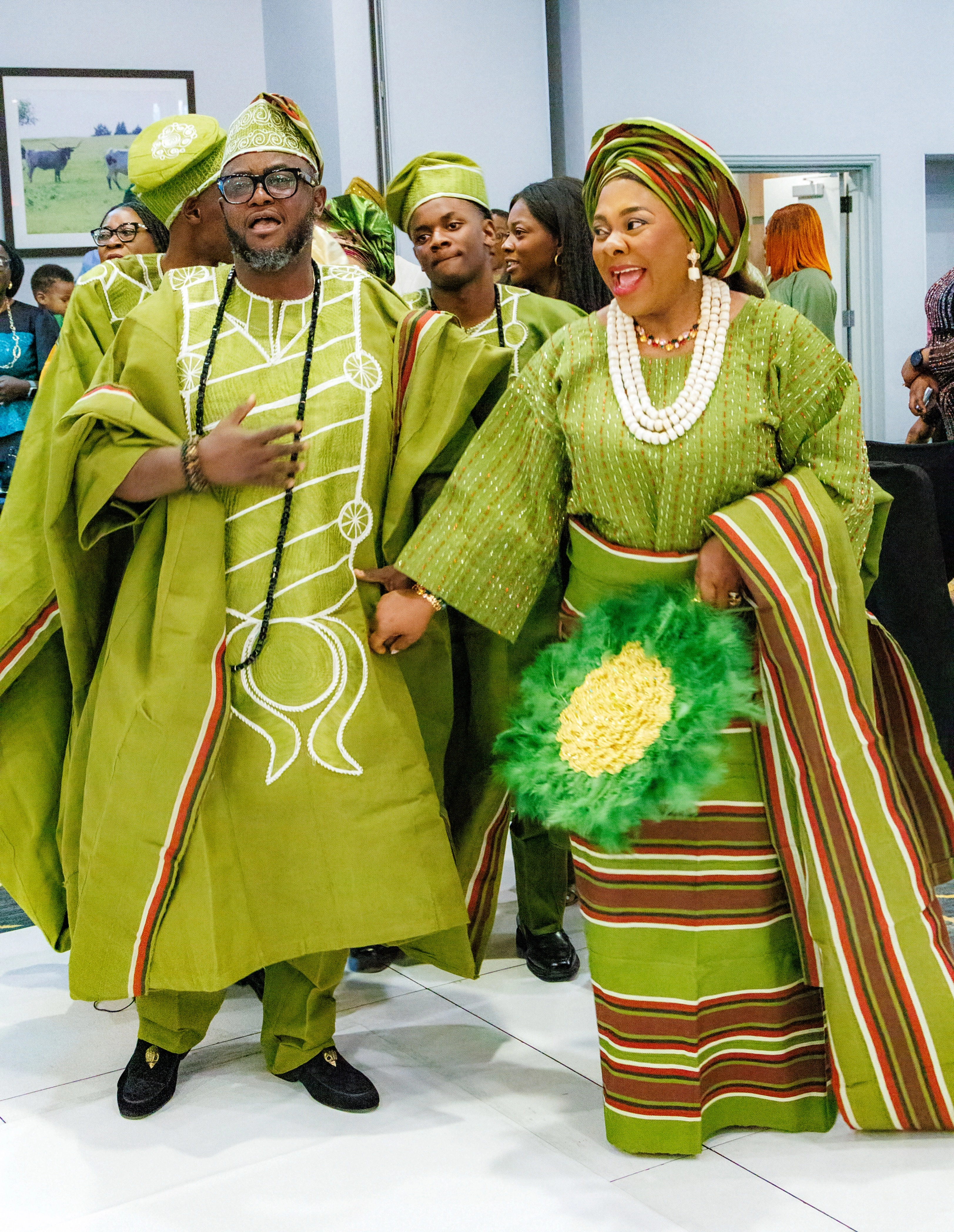 Traditional ceremony couple in coordinated lime green aso-oke